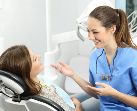 Woman talking to trusted dental team member