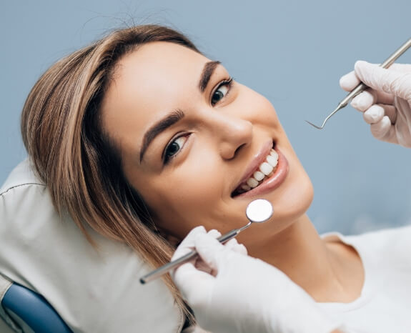 Woman receiving gum disease treatment