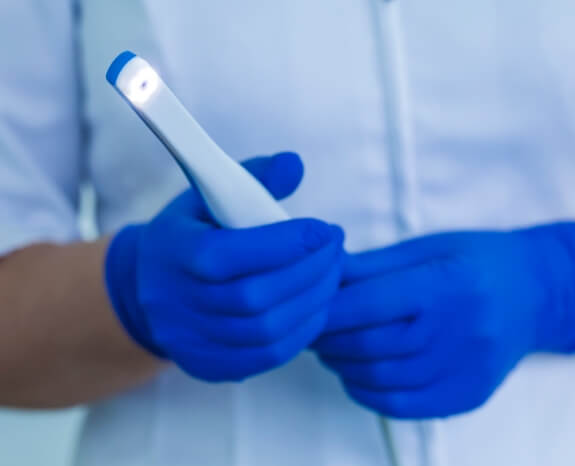 Dentist holding an intraoral camera