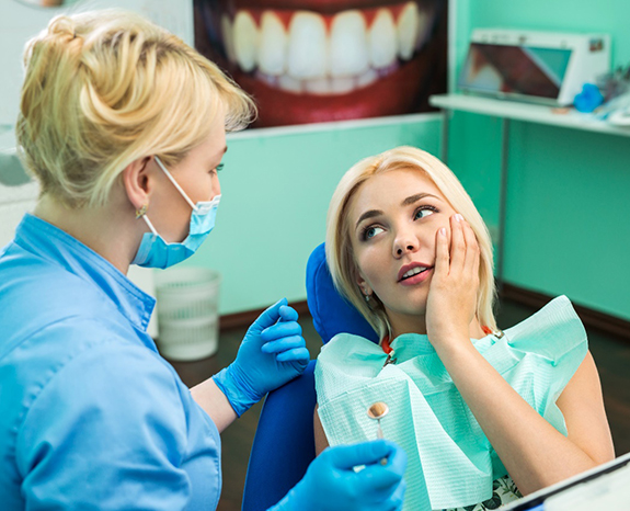 An emergency dentist in Plano treating a patient