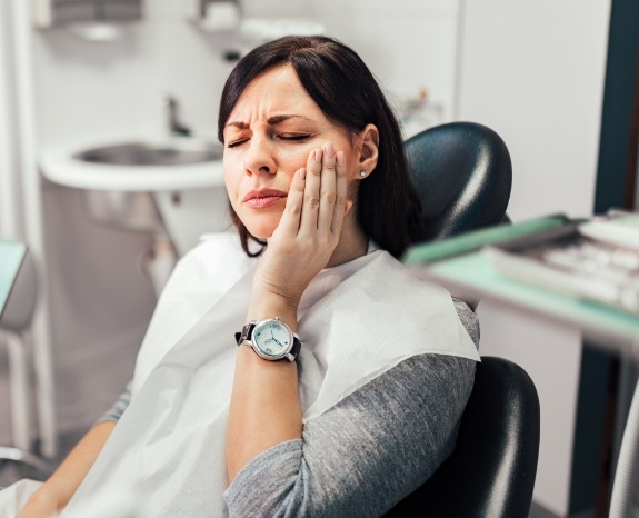 Woman in pain before emergency dentistry