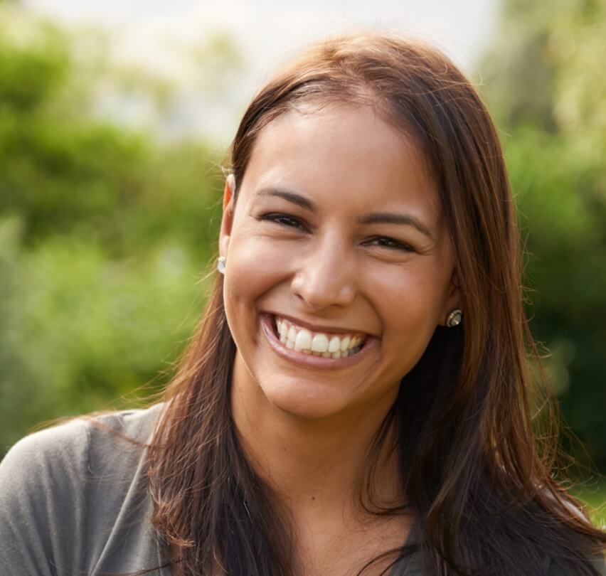 Woman sharing flawless smile after cosmetic dentistry