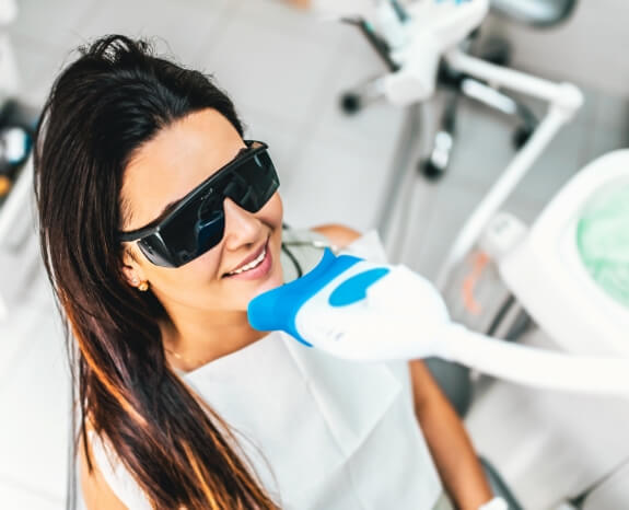 Dental patient receiving teeth whitening