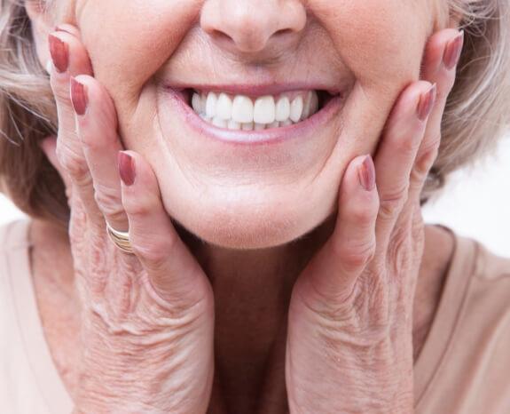 Closeup of woman's flawless smile after full mouth reconstruction