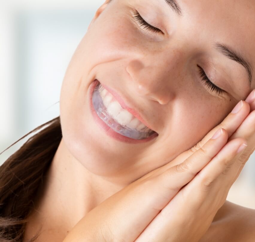 Resting woman with a nightguard for bruxism