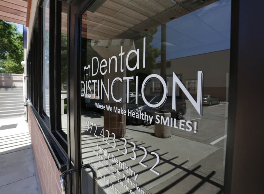 Dental Distinction logo on dental office door