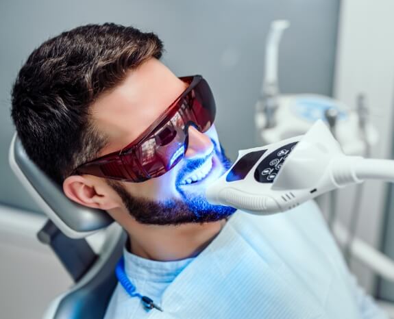 Dental patient receiving professional teeth whitening