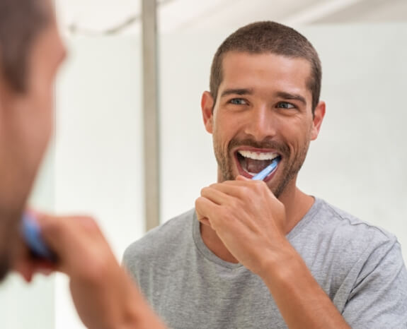 Man brushing teeth