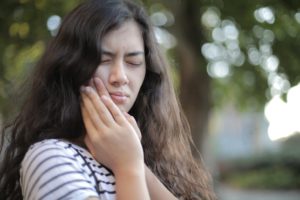 Young woman with a toothache